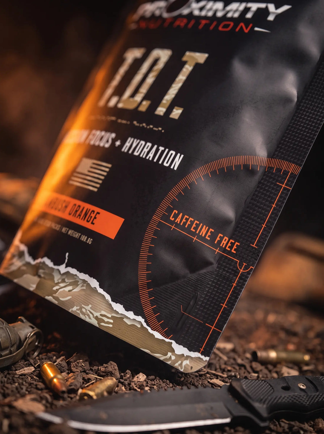 Close-up of a T.O.T. Ambush Orange pouch showing the Caffeine Free mark.
