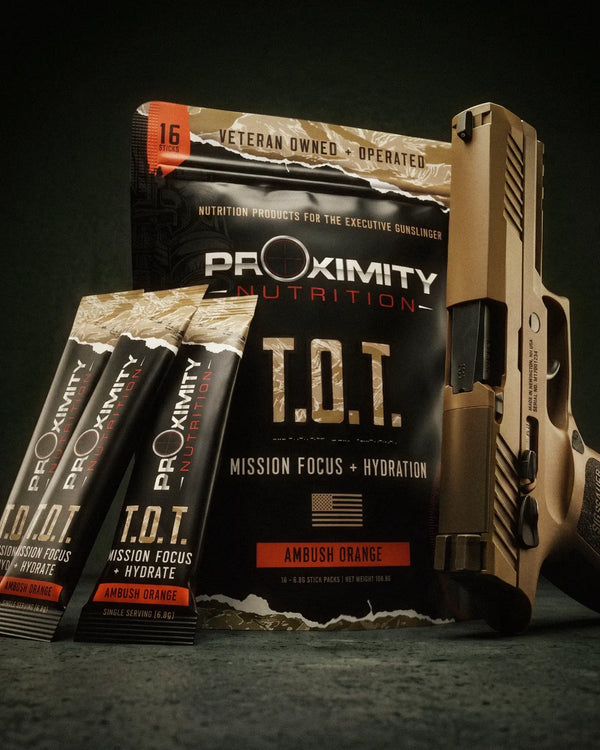T.O.T. Ambush Orange pouch with single-serve stick packs and a tan handgun.