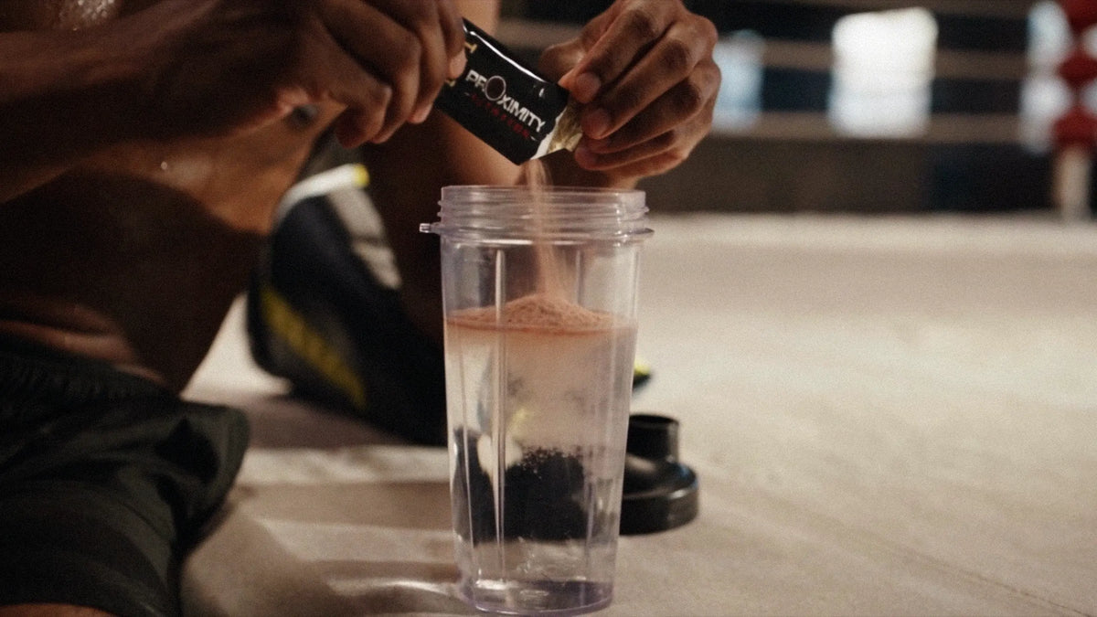 T.O.T. powder poured from a stick pack into a shaker of water.